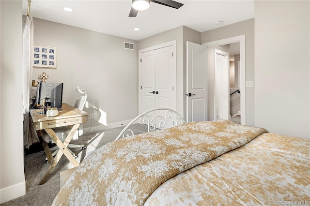 carpeted bedroom with ceiling fan and a closet