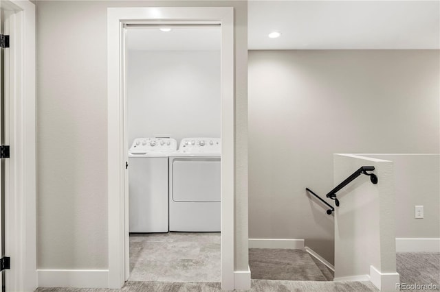 clothes washing area featuring washing machine and dryer