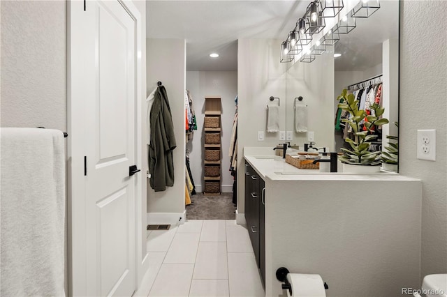 bathroom featuring tile patterned floors and vanity