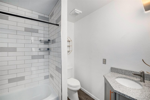 full bath featuring vanity, shower / washtub combination, toilet, visible vents, and wood finished floors