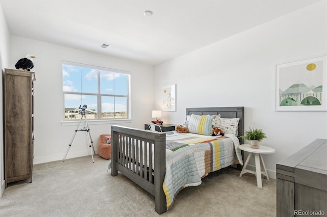 bedroom featuring light colored carpet