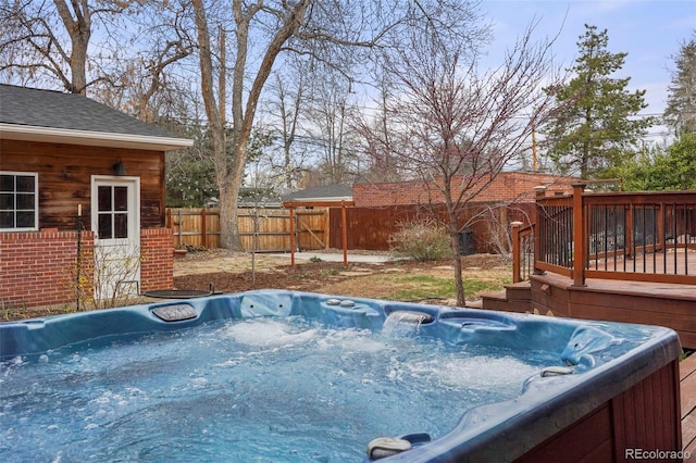 841 Niagara St, Denver, CO 80220 - view of swimming pool with a hot tub, a deck, and a fenced backyard