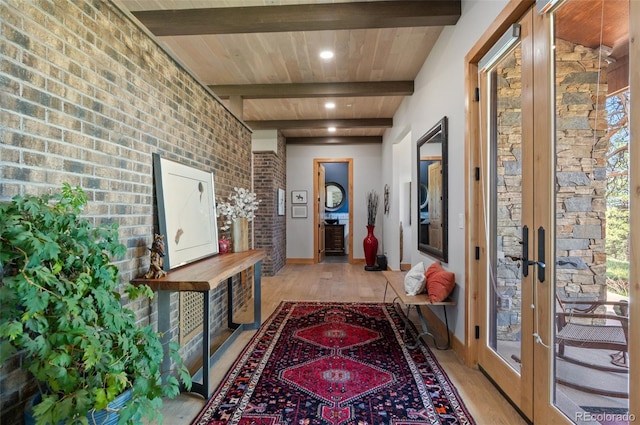 25350 Ridge Way, Golden, CO 80401 - hallway featuring light wood-style floors, french doors, brick wall, wood ceiling with exposed beams, and recessed lighting