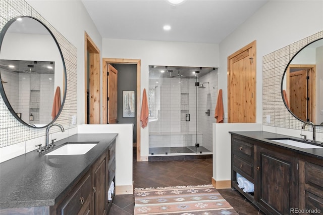 25350 Ridge Way, Golden, CO 80401 - full bath featuring a shower stall, two vanities, and wood finished floors