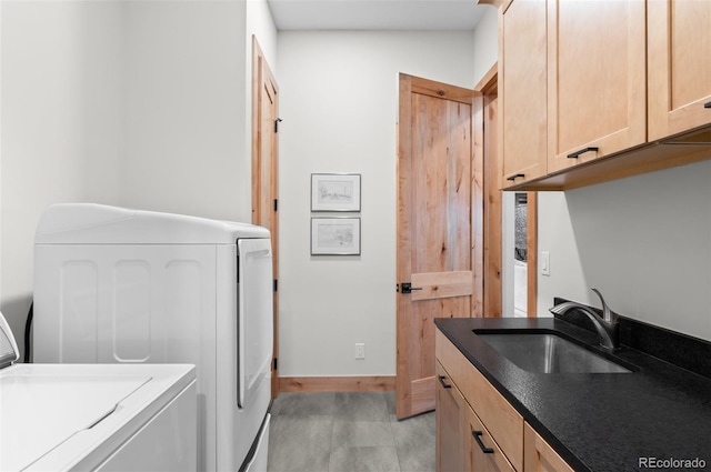 25350 Ridge Way, Golden, CO 80401 - laundry room featuring washer and clothes dryer, cabinet space, and baseboards