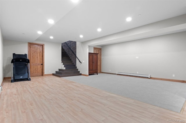 25350 Ridge Way, Golden, CO 80401 - finished below grade area with a baseboard radiator, stairs, light wood-style flooring, and recessed lighting