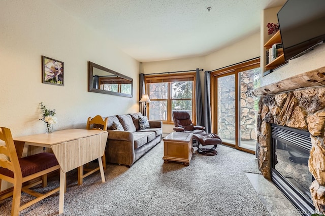 22714 US Highway 6 Unit 5945, Keystone, CO 80435 - living room with light carpet and a fireplace