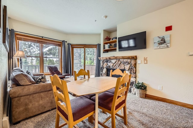 22714 US Highway 6 Unit 5945, Keystone, CO 80435 - dining space with carpet and a stone fireplace