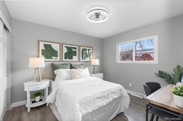 bedroom featuring a closet and dark hardwood / wood-style floors