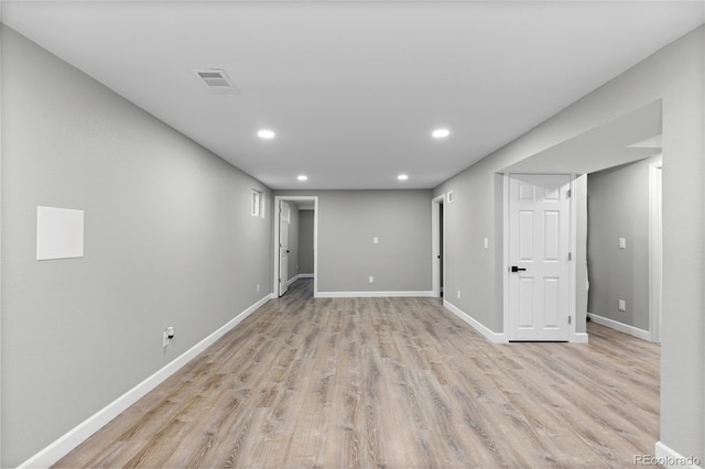 basement featuring light hardwood / wood-style floors