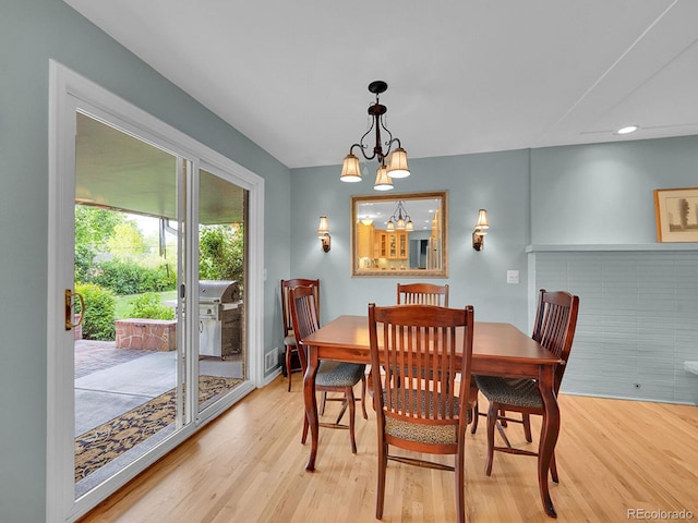 595 W Lake Ave, Littleton, CO 80120 - dining space with wood finished floors, a chandelier, recessed lighting, and baseboards