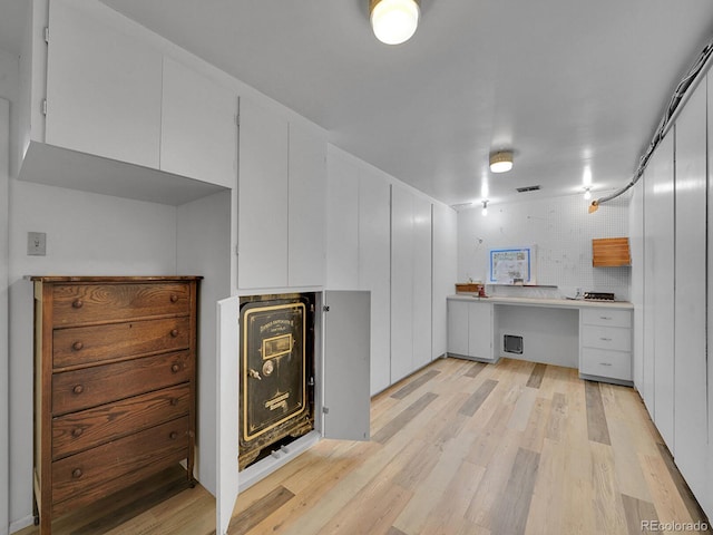 595 W Lake Ave, Littleton, CO 80120 - kitchen featuring light wood-style floors, white cabinets, and light countertops