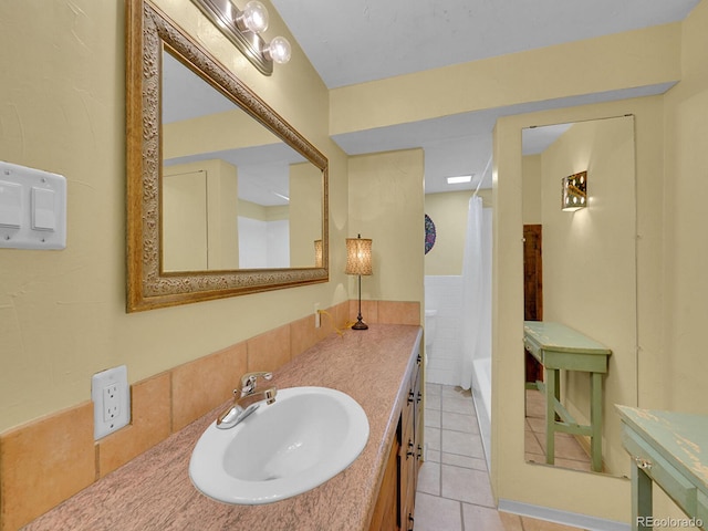 595 W Lake Ave, Littleton, CO 80120 - bathroom featuring vanity, tile patterned floors, and shower / bathtub combination with curtain