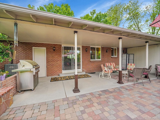 595 W Lake Ave, Littleton, CO 80120 - view of patio / terrace featuring an outdoor hangout area, central AC unit, and a grill
