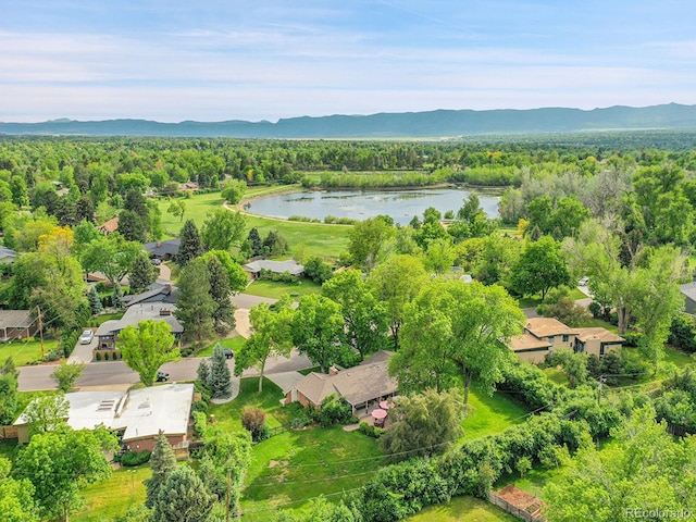 595 W Lake Ave, Littleton, CO 80120 - aerial view of residential area featuring a water and mountain view and a heavily wooded area