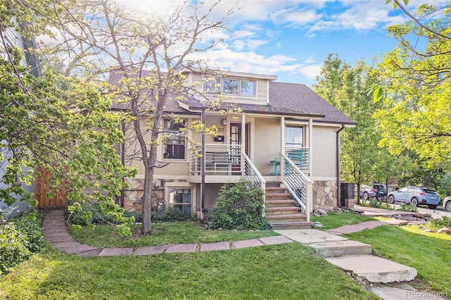 2507 9th St, Boulder, CO 80304 - view of front of home with a front yard, stucco siding, stairs, a shingled roof, and stone siding