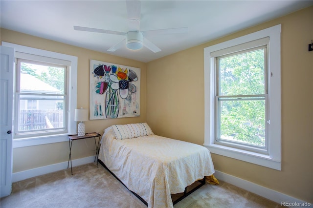2507 9th St, Boulder, CO 80304 - bedroom with multiple windows, light carpet, and a ceiling fan