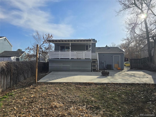 back of house with central AC unit, stairway, a patio area, and a fenced backyard