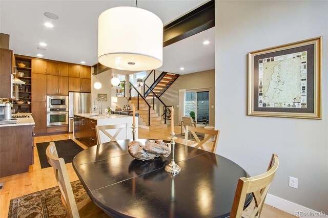 357 Pascal St, Fort Collins, CO 80524 - dining space featuring stairs, light wood-style flooring, recessed lighting, and baseboards