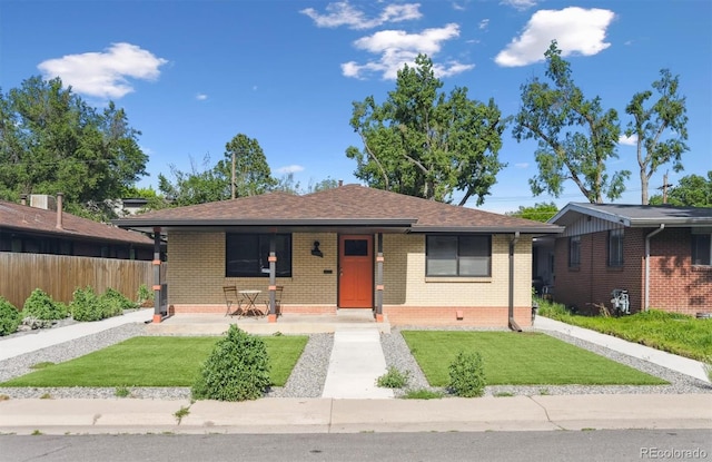 1112-11121/2 Krameria St, Denver, CO 80220 - bungalow-style house with a porch and brick siding