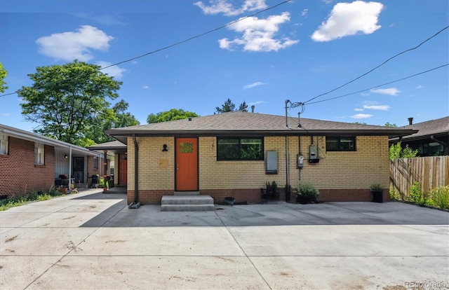 1112-11121/2 Krameria St, Denver, CO 80220 - view of front facade featuring brick siding and entry steps
