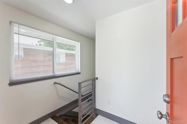 1112-11121/2 Krameria St, Denver, CO 80220 - staircase with baseboards