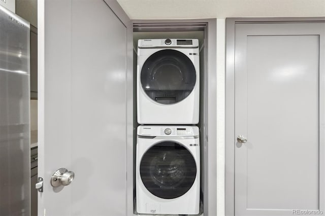 1112-11121/2 Krameria St, Denver, CO 80220 - laundry room featuring stacked washer / dryer