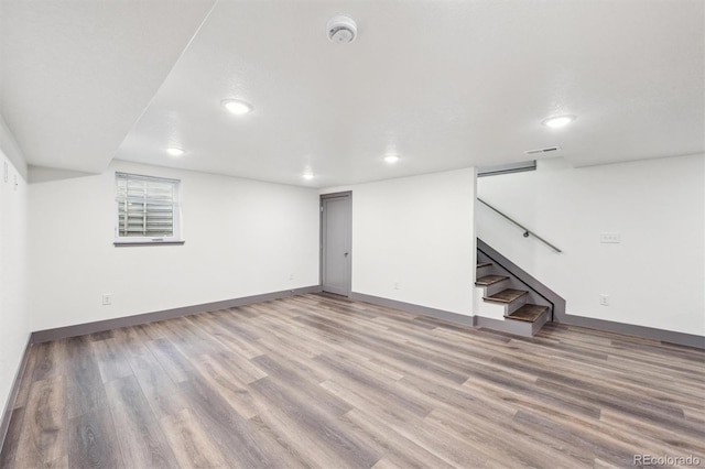 1112-11121/2 Krameria St, Denver, CO 80220 - basement with recessed lighting, light wood finished floors, and stairway