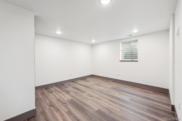 1112-11121/2 Krameria St, Denver, CO 80220 - spare room with wood finished floors and recessed lighting