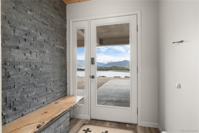 369 County Road 4051, Granby, CO 80446 - entryway featuring a water and mountain view, light wood-style flooring, and baseboards