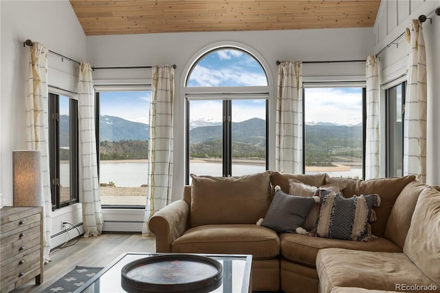 369 County Road 4051, Granby, CO 80446 - living area featuring vaulted ceiling, light wood-style floors, wood ceiling, and a water and mountain view