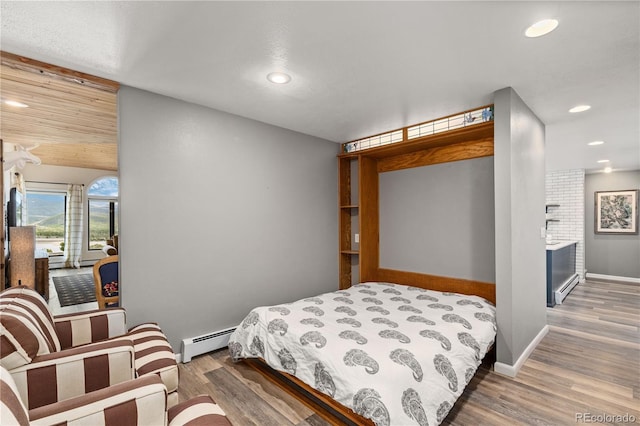 369 County Road 4051, Granby, CO 80446 - bedroom featuring baseboard heating, wood finished floors, recessed lighting, and baseboards
