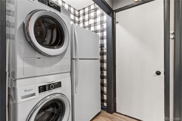 369 County Road 4051, Granby, CO 80446 - laundry room featuring stacked washer / drying machine and light wood finished floors