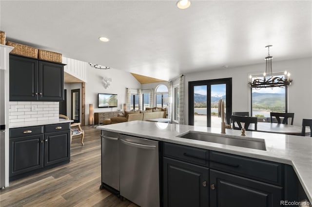 369 County Road 4051, Granby, CO 80446 - kitchen with dishwasher, a sink, light countertops, lofted ceiling, and dark wood-type flooring