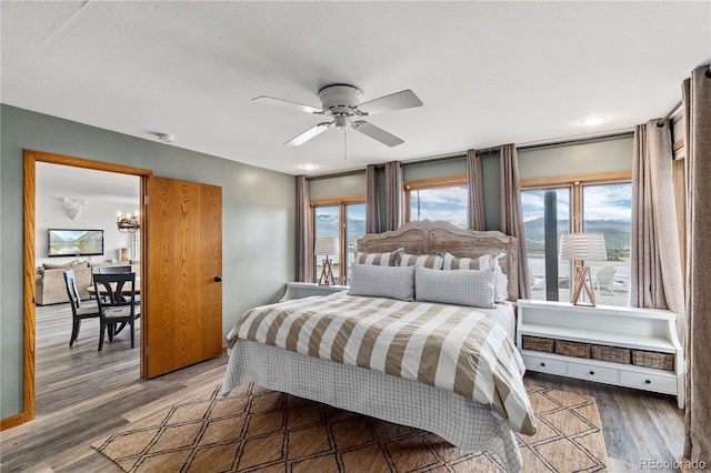 369 County Road 4051, Granby, CO 80446 - bedroom with wood finished floors, a chandelier, and ceiling fan