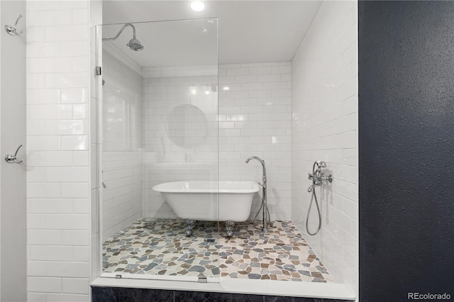 369 County Road 4051, Granby, CO 80446 - full bathroom featuring a soaking tub and tiled shower
