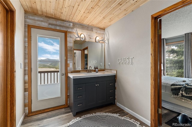 369 County Road 4051, Granby, CO 80446 - bathroom featuring vanity, wood finished floors, wooden ceiling, and baseboards
