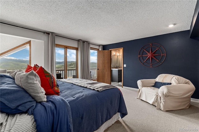 369 County Road 4051, Granby, CO 80446 - carpeted bedroom with a textured ceiling, access to exterior, and baseboards