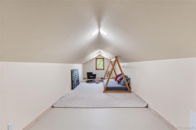 369 County Road 4051, Granby, CO 80446 - unfurnished bedroom featuring vaulted ceiling, a textured ceiling, and finished concrete flooring