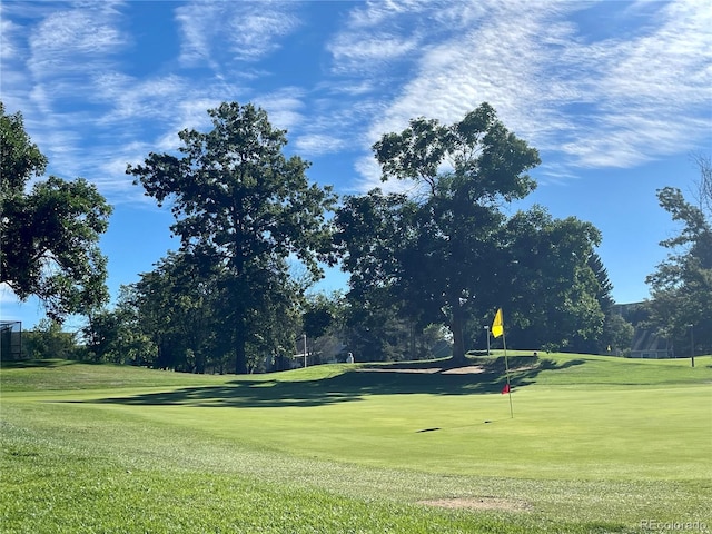 view of property's community featuring a yard and golf course view