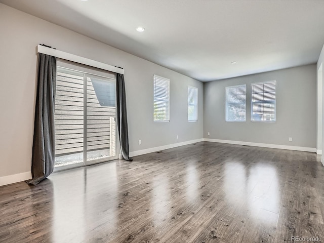 4773 Kittredge St, Denver, CO 80239 - empty room featuring wood finished floors, baseboards, and recessed lighting