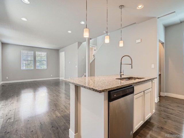 4773 Kittredge St, Denver, CO 80239 - kitchen featuring dishwasher, a sink, light stone countertops, dark wood finished floors, and pendant lighting