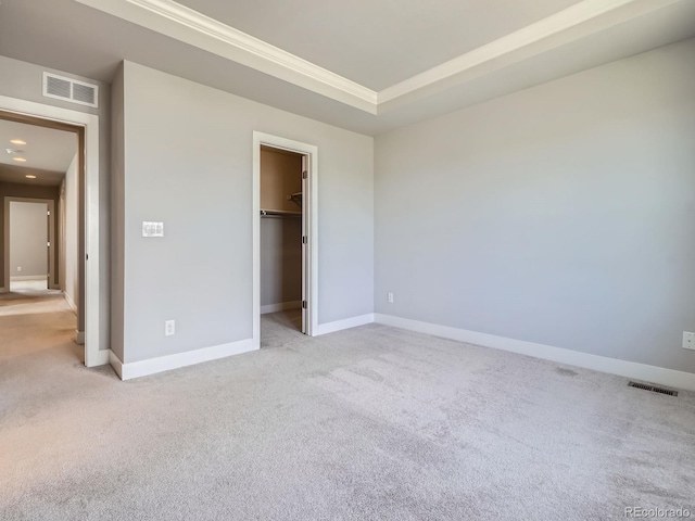 4773 Kittredge St, Denver, CO 80239 - unfurnished bedroom with carpet floors, crown molding, a spacious closet, and baseboards