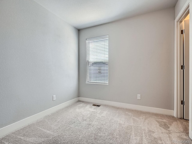 4773 Kittredge St, Denver, CO 80239 - empty room featuring light colored carpet and baseboards