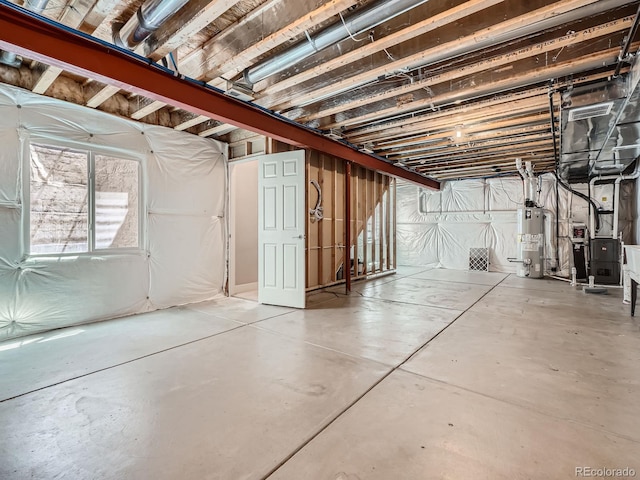 4773 Kittredge St, Denver, CO 80239 - below grade area featuring gas water heater and heating unit