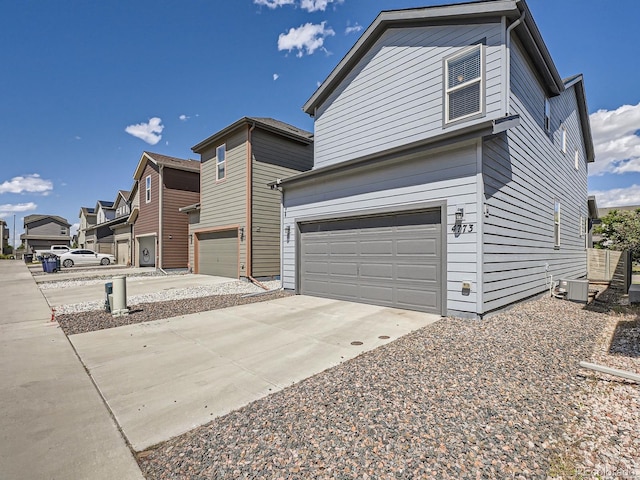 4773 Kittredge St, Denver, CO 80239 - view of front of property with a garage and concrete driveway