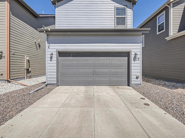 4773 Kittredge St, Denver, CO 80239 - garage featuring concrete driveway