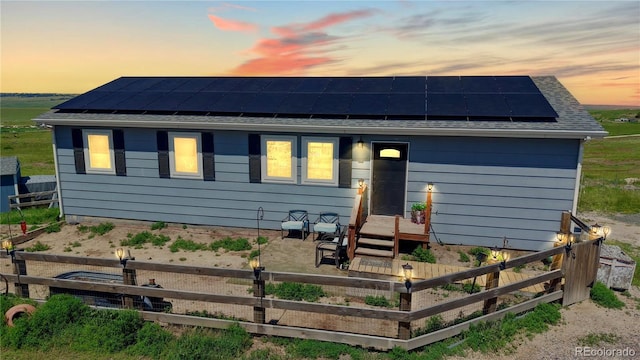 40291 Gold Nugget Dr, Deer Trail, CO 80105 - view of front of house with roof mounted solar panels and a garden