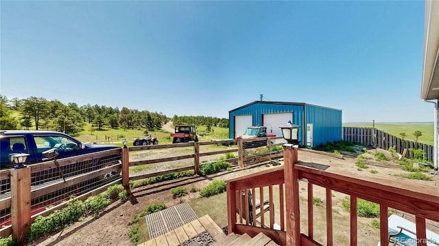 40291 Gold Nugget Dr, Deer Trail, CO 80105 - wooden deck featuring a garage and an outbuilding