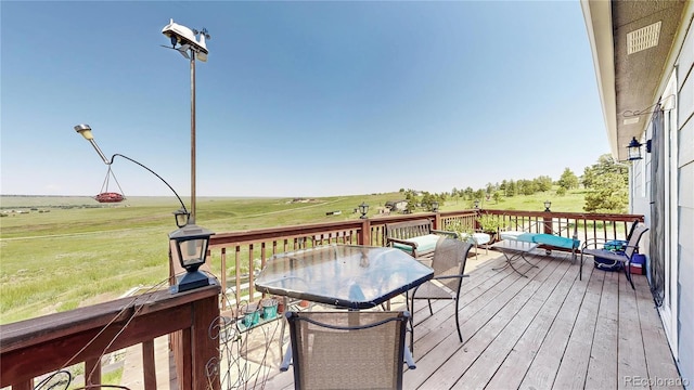 40291 Gold Nugget Dr, Deer Trail, CO 80105 - deck featuring outdoor dining space and a rural view